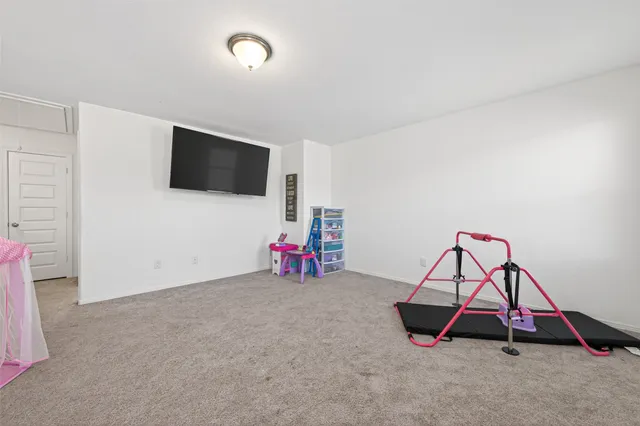 a room with furniture and flat screen tv