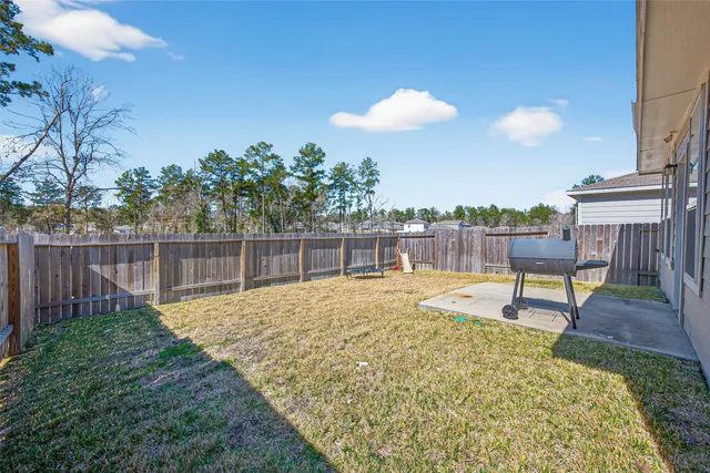 a swimming pool with wooden fence