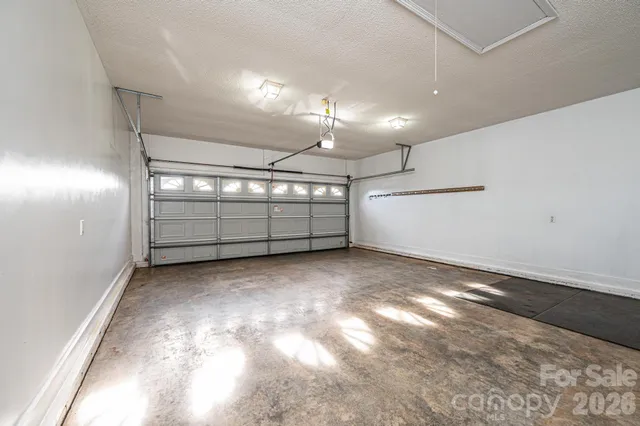 a view of a bathroom with tub and door