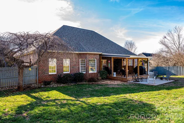 a front view of a house with a yard table and chairs