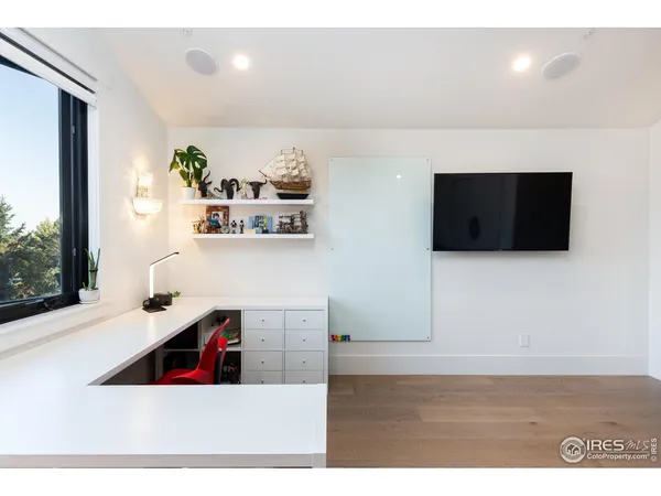 a living room with a flat screen tv and a couch