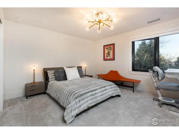 a bedroom with bed and window