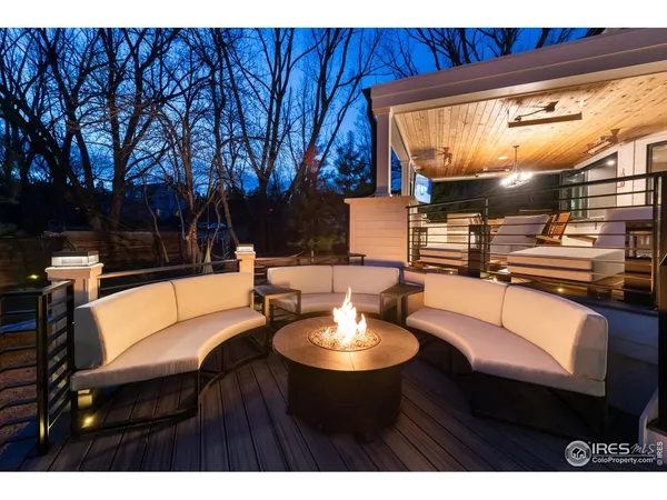 a balcony with table and chairs