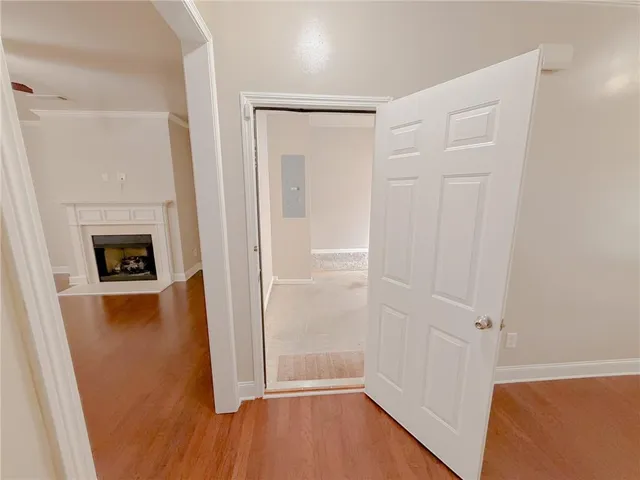 a view of livingroom with hardwood floor and a fireplace