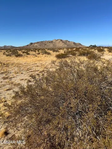 a view of ocean with mountains in the background