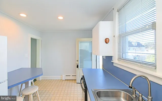 a view of kitchen with a sink and a window