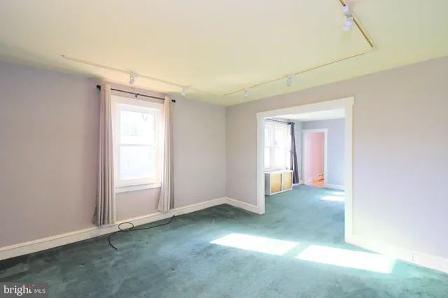 an empty room with windows