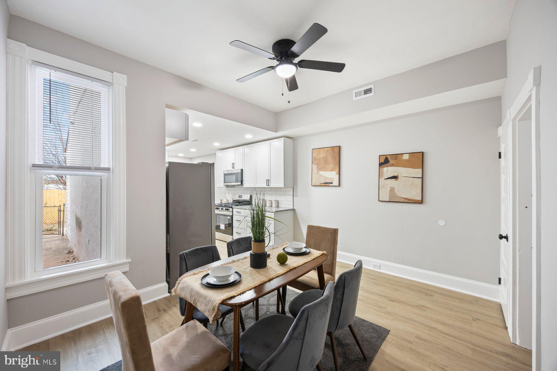 3611 Chestnut Avenue Baltimore, MD 21211 - Photo 12 of 38 a view of a dining room with furniture window and wooden floor