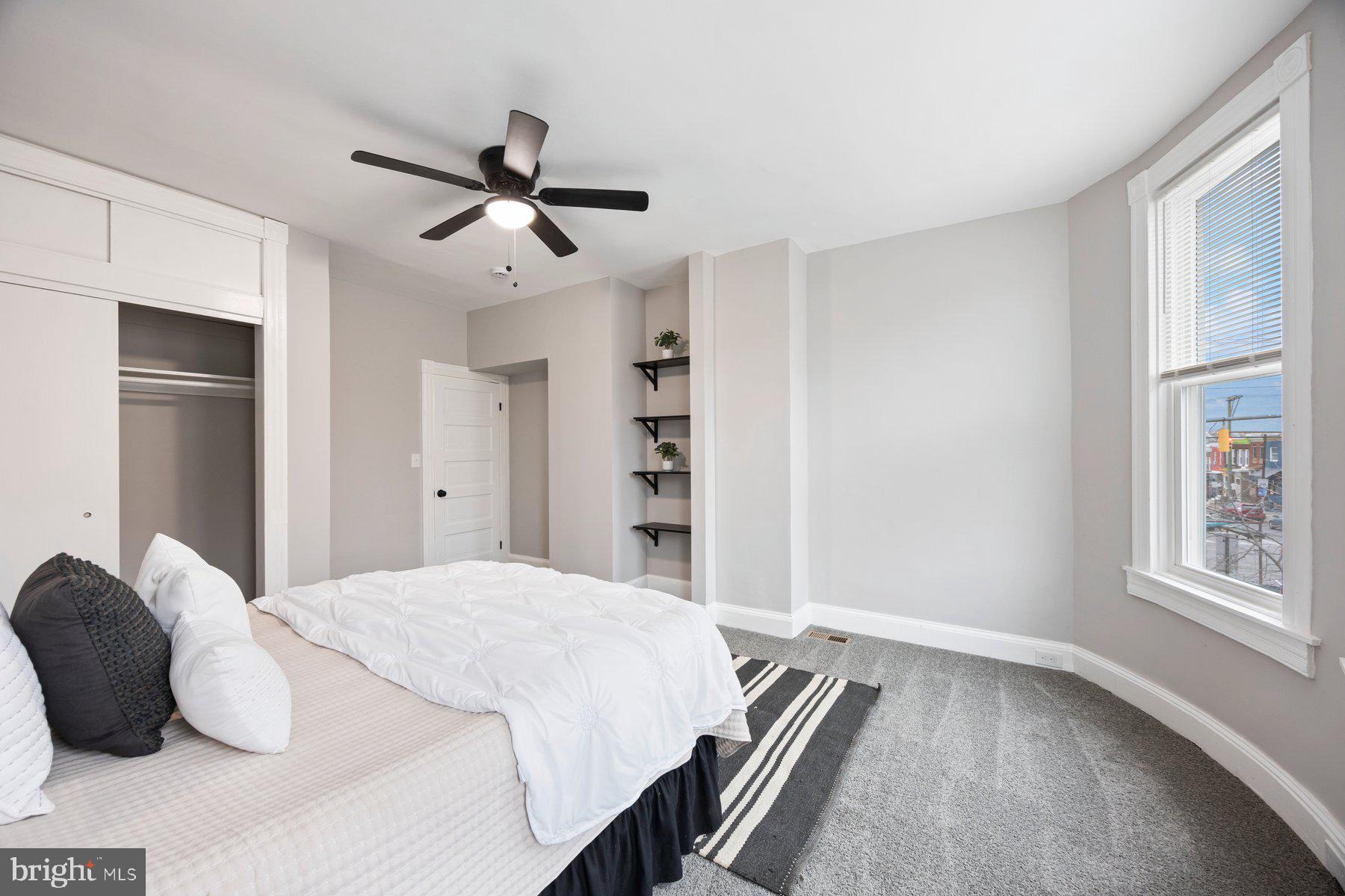 3611 Chestnut Avenue Baltimore, MD 21211 - Photo 24 of 38 a bedroom with a large bed and a window