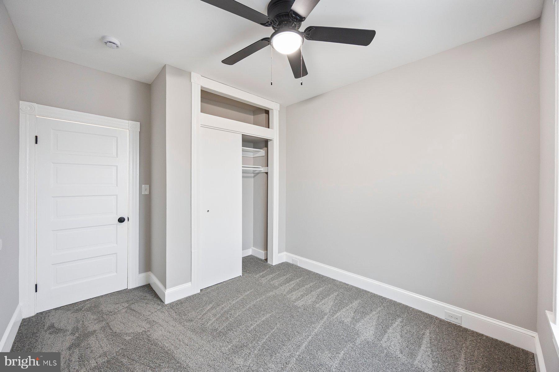 3611 Chestnut Avenue Baltimore, MD 21211 - Photo 30 of 38 an empty room with closet and a chandelier fan