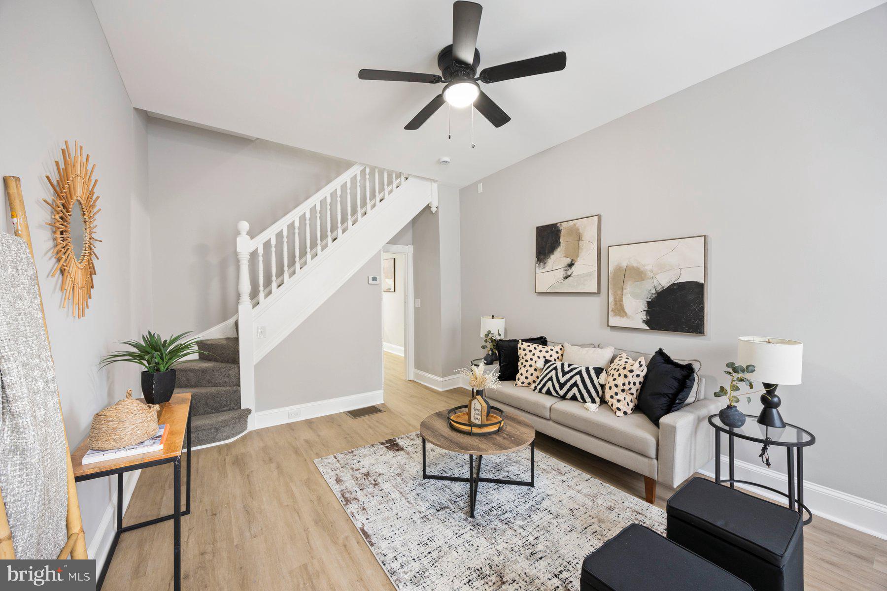3611 Chestnut Avenue Baltimore, MD 21211 - Photo 5 of 38 a living room with furniture and a potted plant
