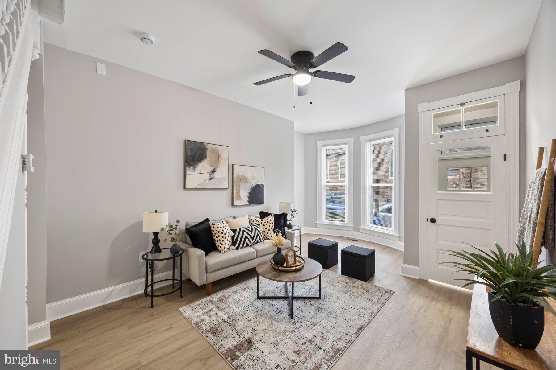 3611 Chestnut Avenue Baltimore, MD 21211 - Photo 6 of 38 a living room with furniture and a window