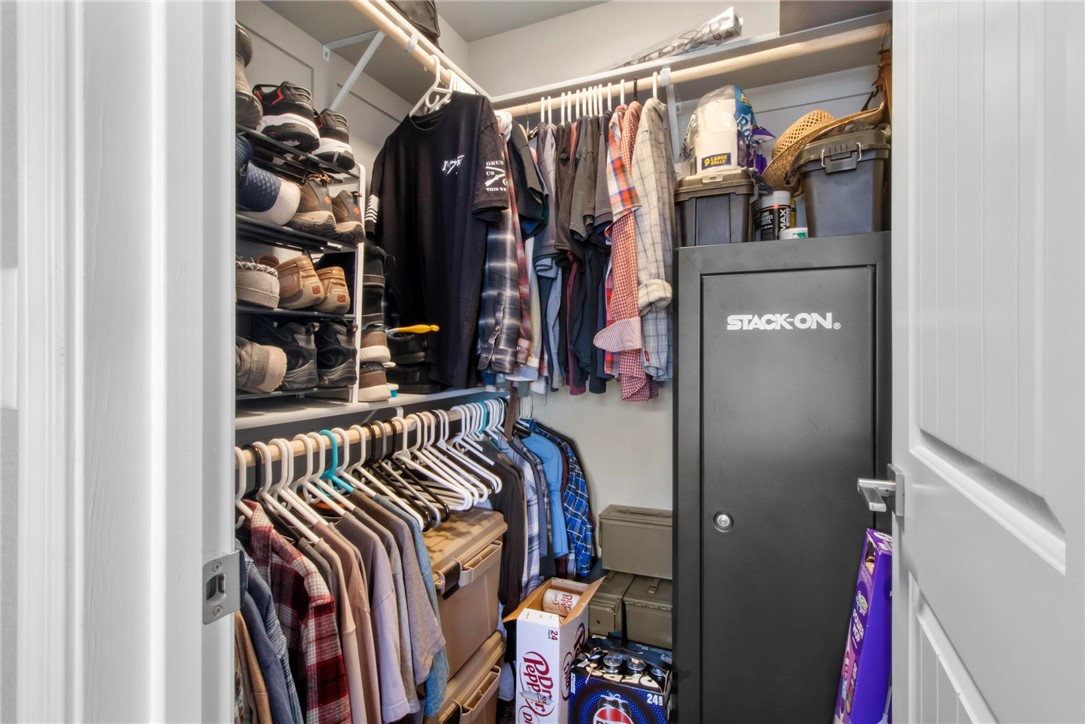 3897 Easy Street Kingman, AZ 86409 - Photo 27 of 53 a view of walk in closet with clothes and shoes