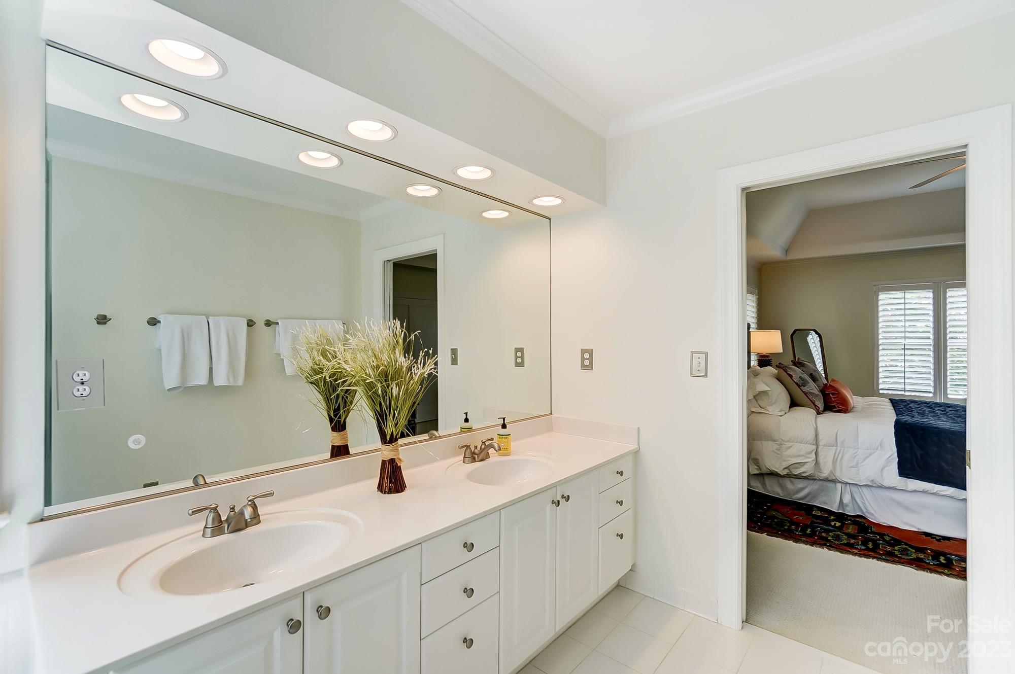 2407 Queensland Drive Charlotte, NC 28270 - Photo 21 of 42 a spacious en suite bathroom with double sink and a mirror