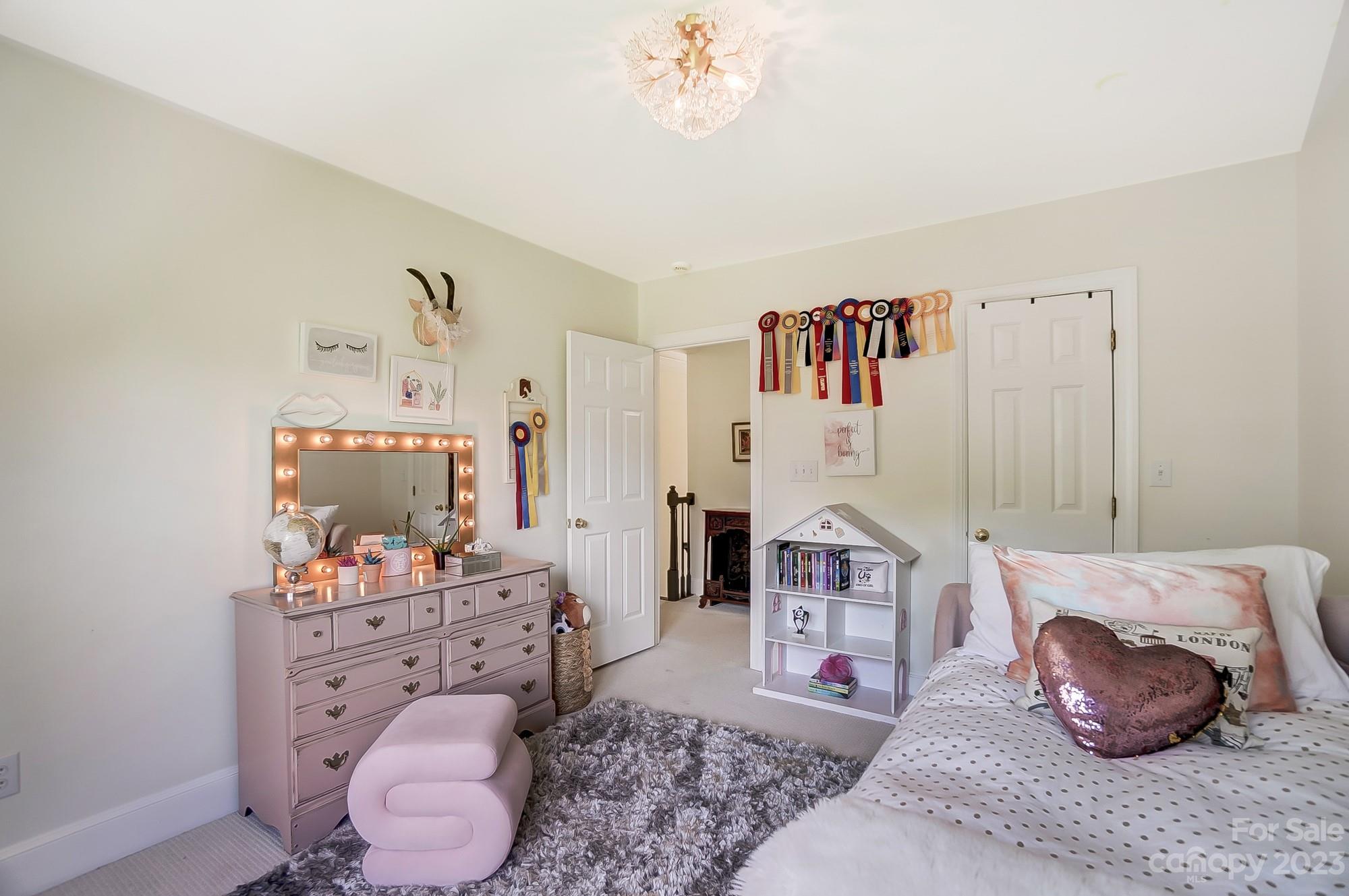 2407 Queensland Drive Charlotte, NC 28270 - Photo 29 of 42 a living room with furniture and a baby crib
