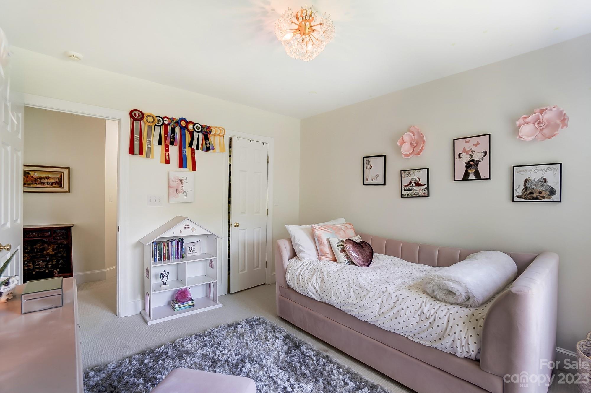 2407 Queensland Drive Charlotte, NC 28270 - Photo 30 of 42 a bedroom with a bed and a couch