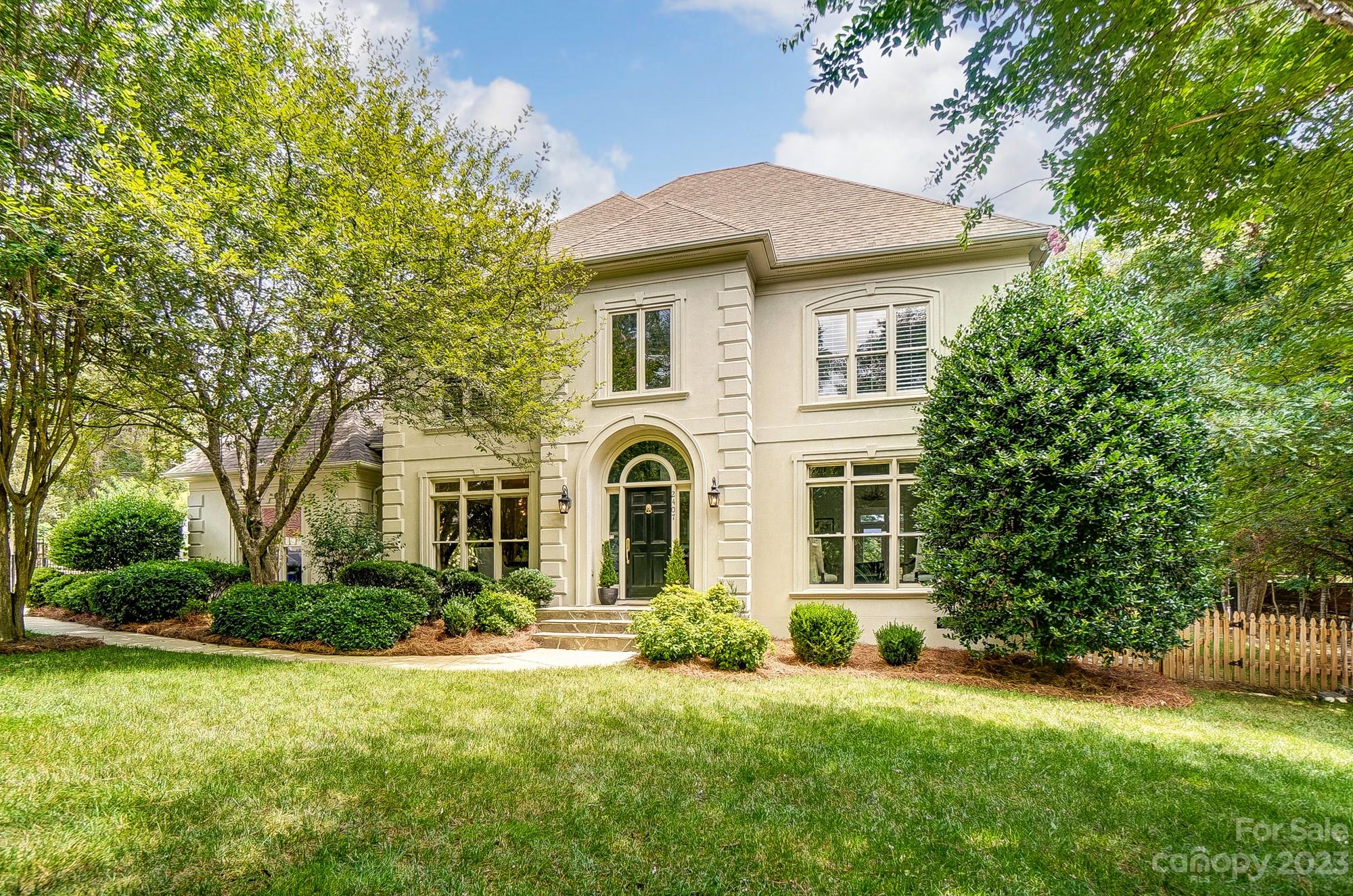 2407 Queensland Drive Charlotte, NC 28270 - Photo 3 of 42 a front view of a house with a yard