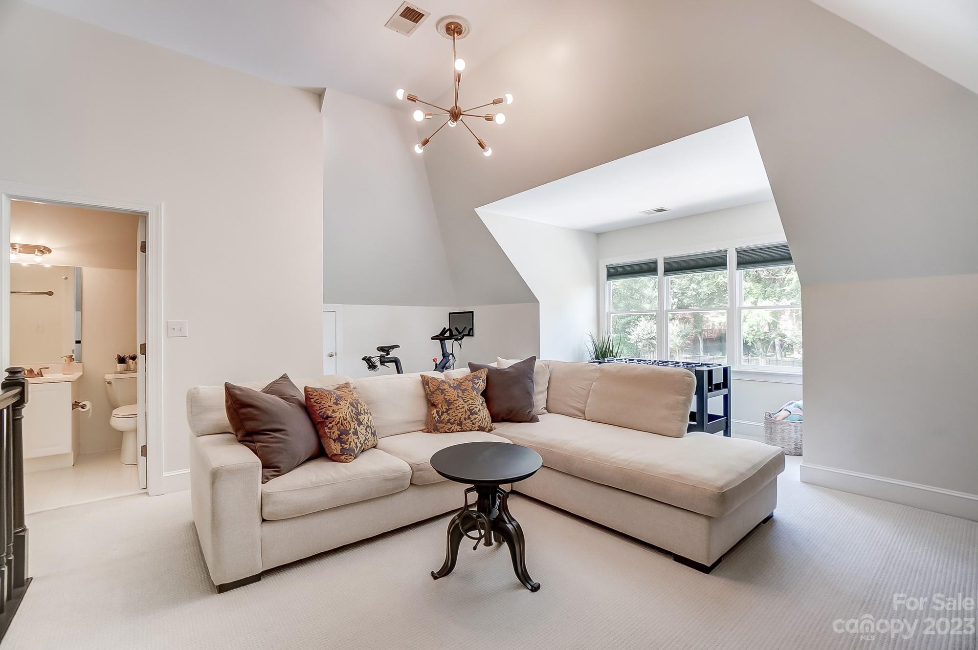 2407 Queensland Drive Charlotte, NC 28270 - Photo 35 of 42 a living room with furniture and a large window