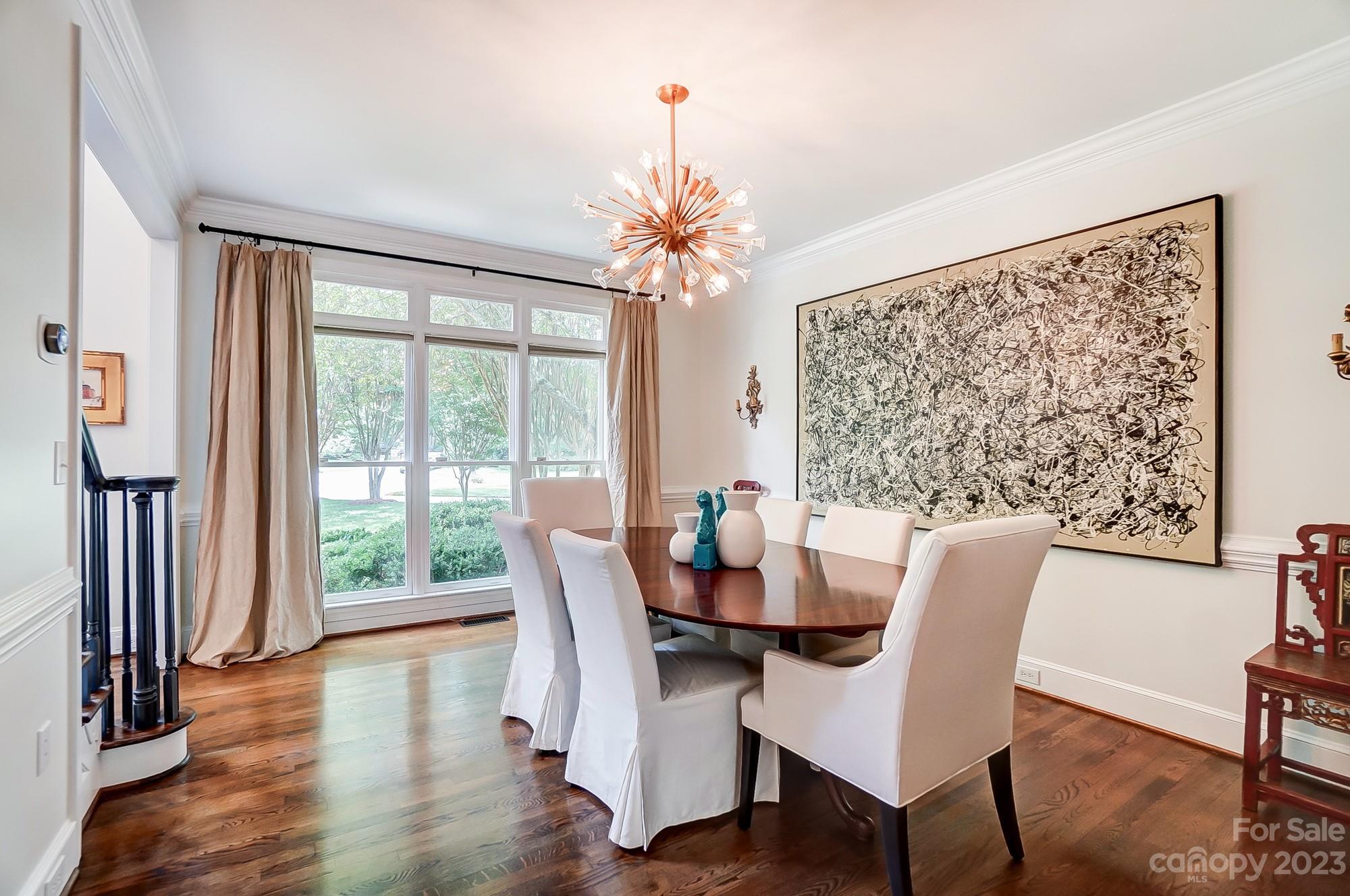 2407 Queensland Drive Charlotte, NC 28270 - Photo 7 of 42 a view of a dining room with furniture window and wooden floor