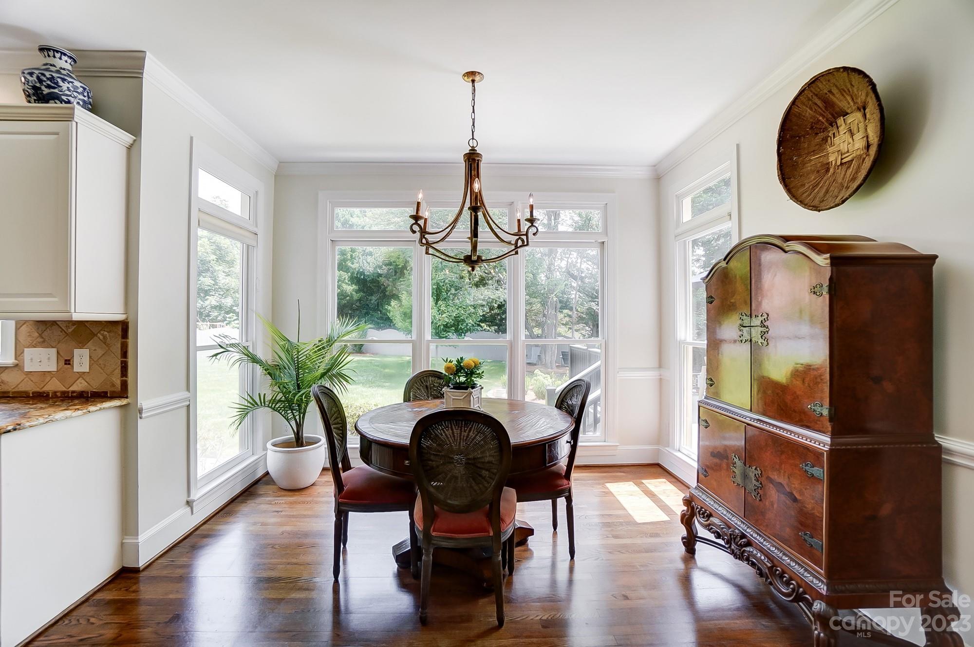 2407 Queensland Drive Charlotte, NC 28270 - Photo 10 of 42 a view of a dining room with furniture window and wooden floor