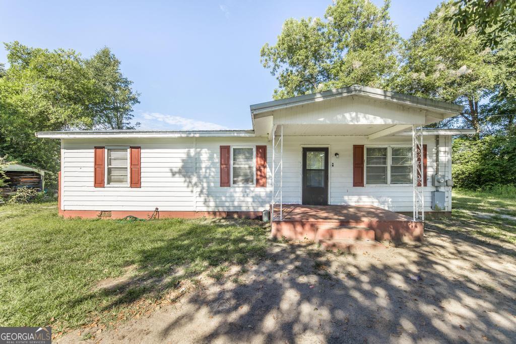 511 Forsyth Street Montezuma, GA 31063 - Photo 2 of 12 a front view of a house with a yard