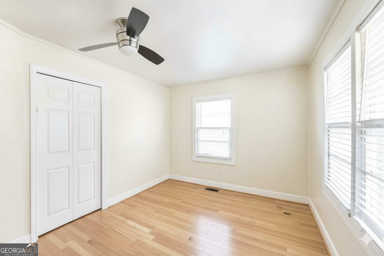 511 Forsyth Street Montezuma, GA 31063 - Photo 9 of 12 a view of an empty room with a window