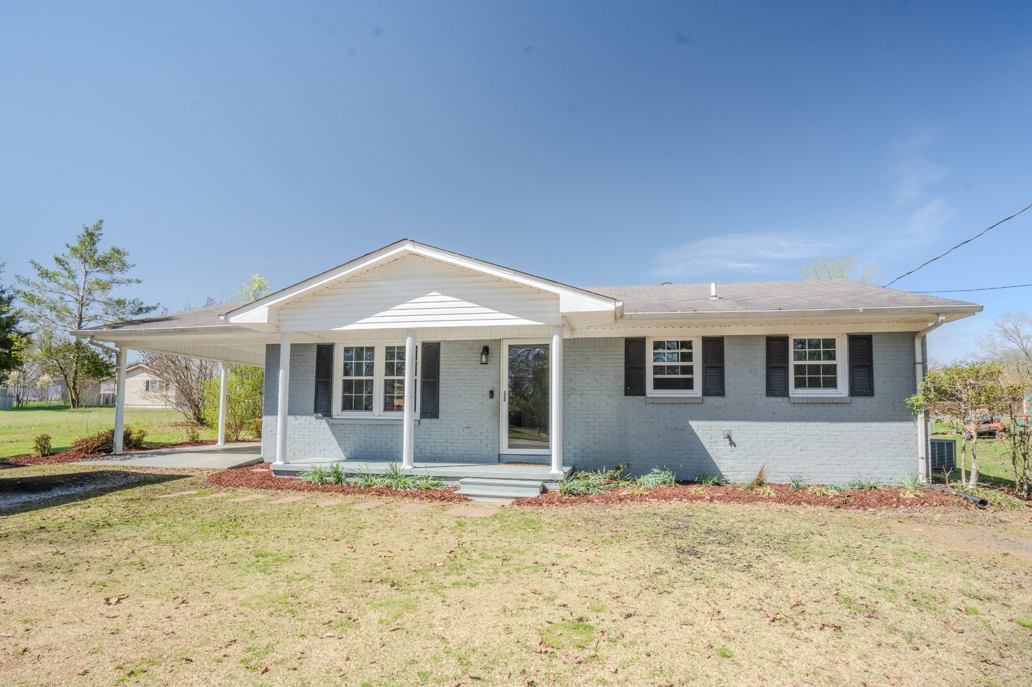 705 North Military Street Loretto, TN 38469 - Photo 2 of 16 a front view of a house with a yard