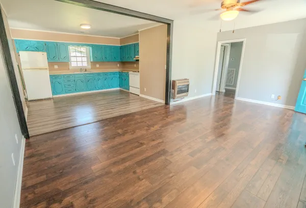 a view of a bathroom with wooden floor and stairs