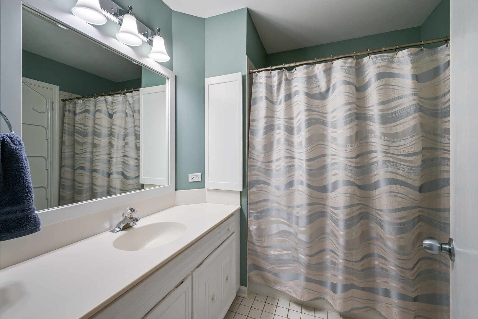 2S050 Taylor Road Glen Ellyn, IL 60137 - Photo 17 of 24 a bathroom with a double vanity sink and a large mirror