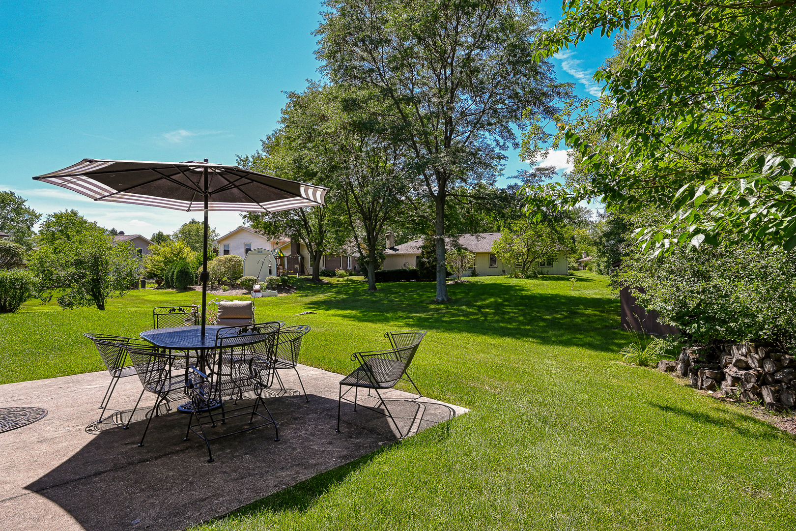 2S050 Taylor Road Glen Ellyn, IL 60137 - Photo 20 of 24 a view of a table and chairs in backyard of the house