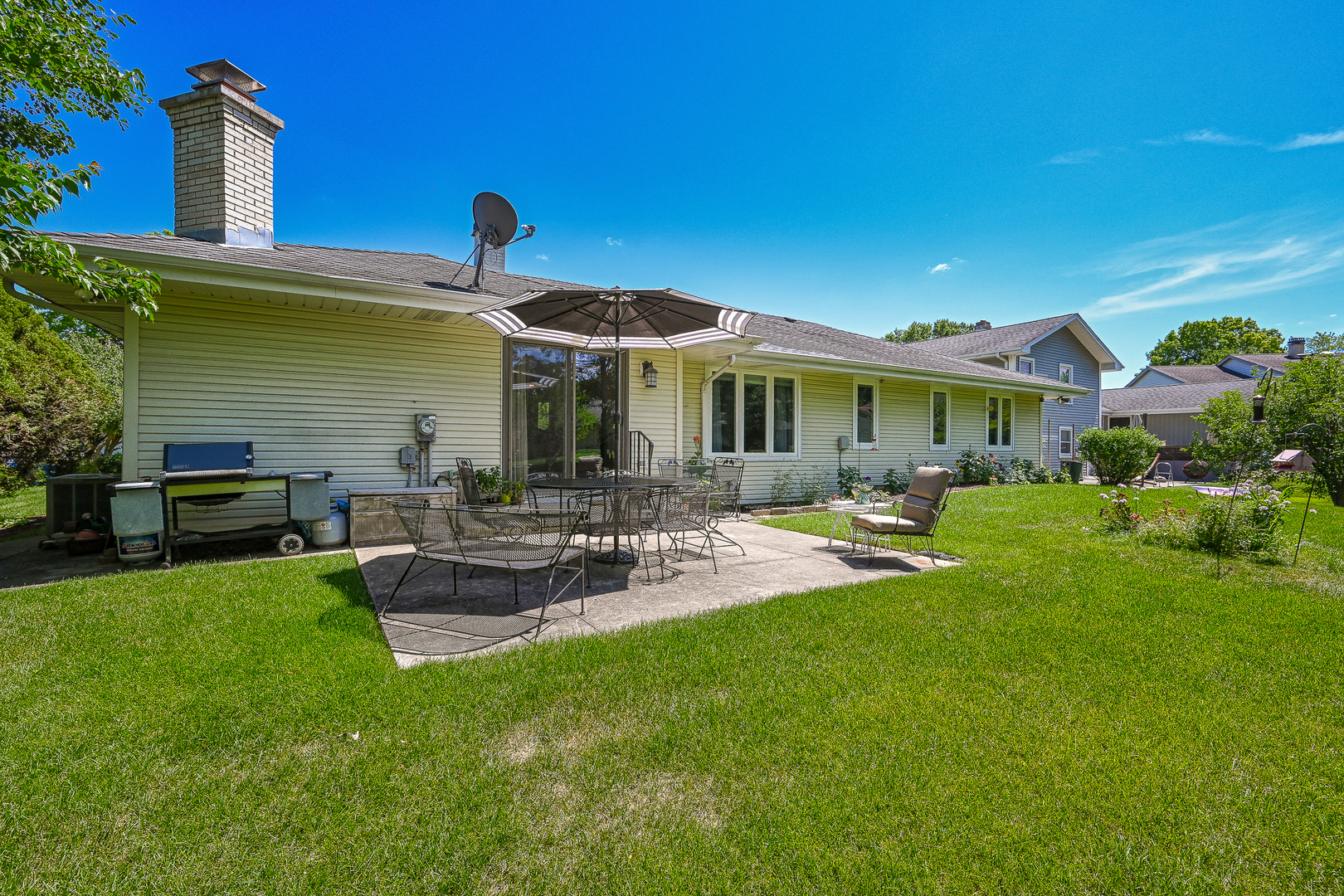 2S050 Taylor Road Glen Ellyn, IL 60137 - Photo 21 of 24 a front view of a house with patio and garden