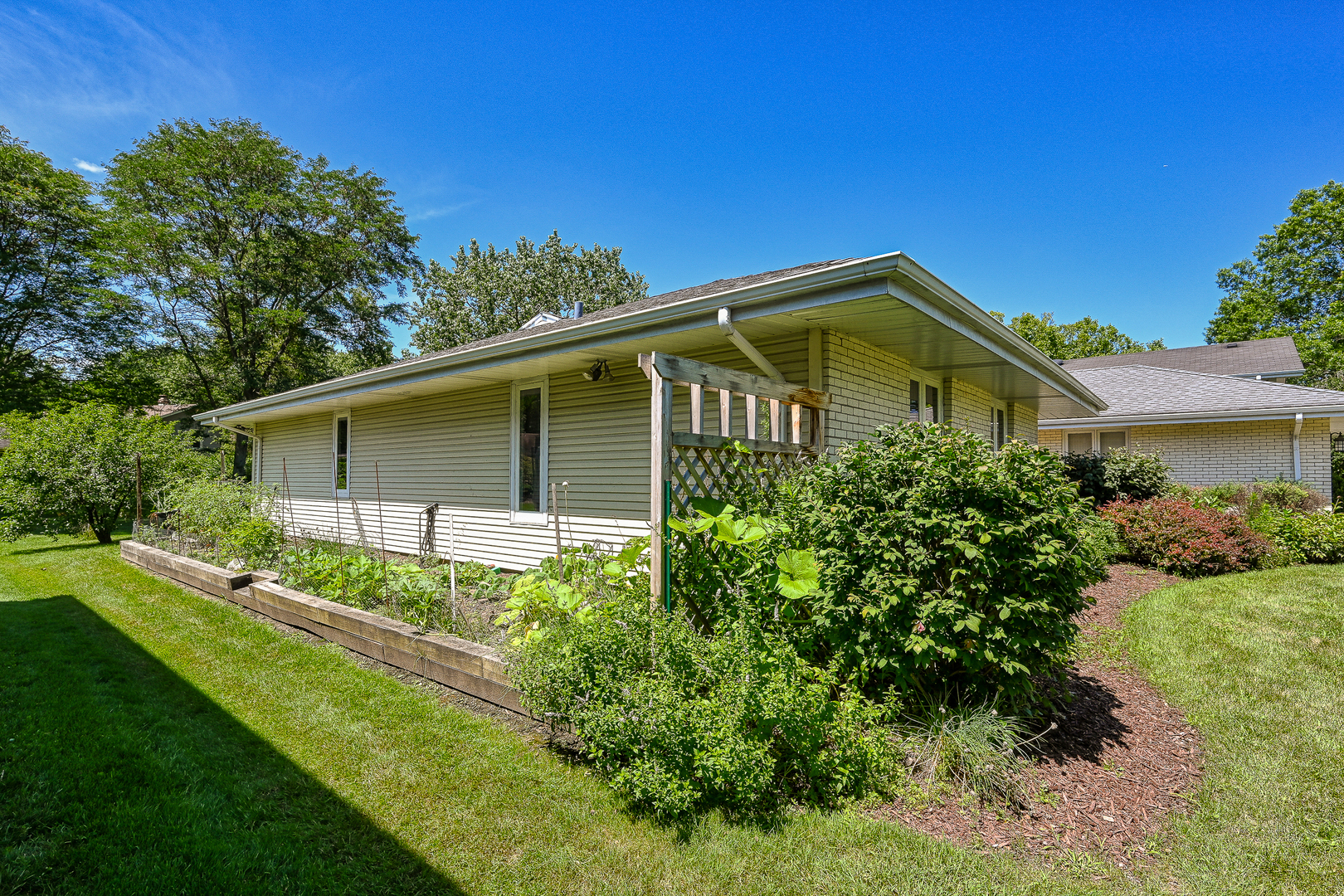 2S050 Taylor Road Glen Ellyn, IL 60137 - Photo 22 of 24 a front view of a house with garden