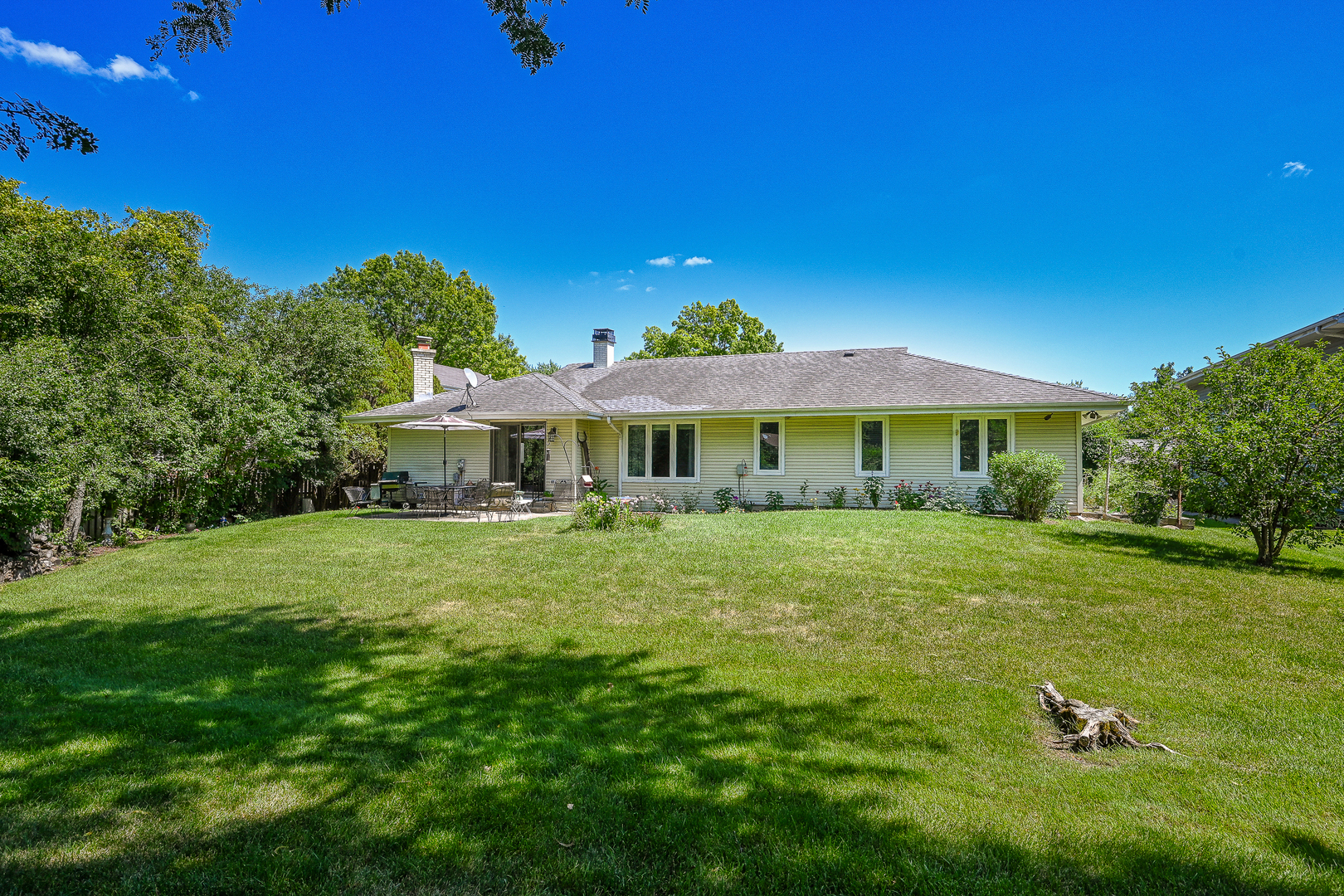 2S050 Taylor Road Glen Ellyn, IL 60137 - Photo 23 of 24 a front view of a house with a garden