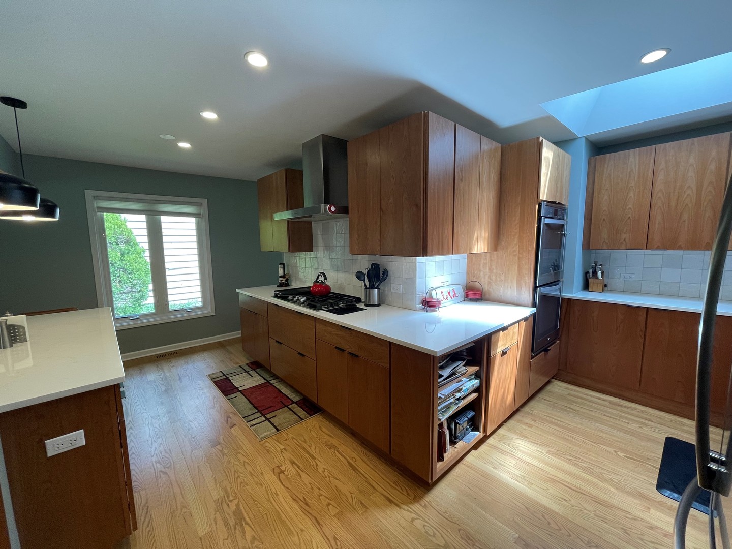 2S050 Taylor Road Glen Ellyn, IL 60137 - Photo 9 of 24 a kitchen with stainless steel appliances a stove a sink a refrigerator and wooden cabinets