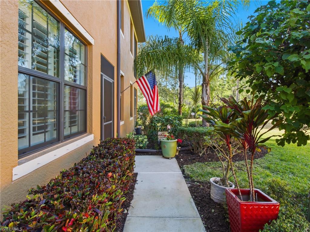 20161 Bravada Street, Unit 2 Estero, FL 33928 - Photo 3 of 33 a view of a house with a backyard