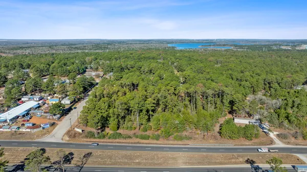 an aerial view of beach and yard