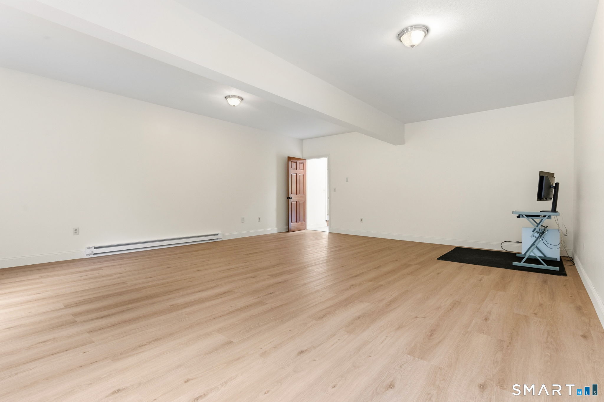 287 South Bear Hill Road Chaplin, CT 06235 - Photo 22 of 37 a view of a room with wooden floor