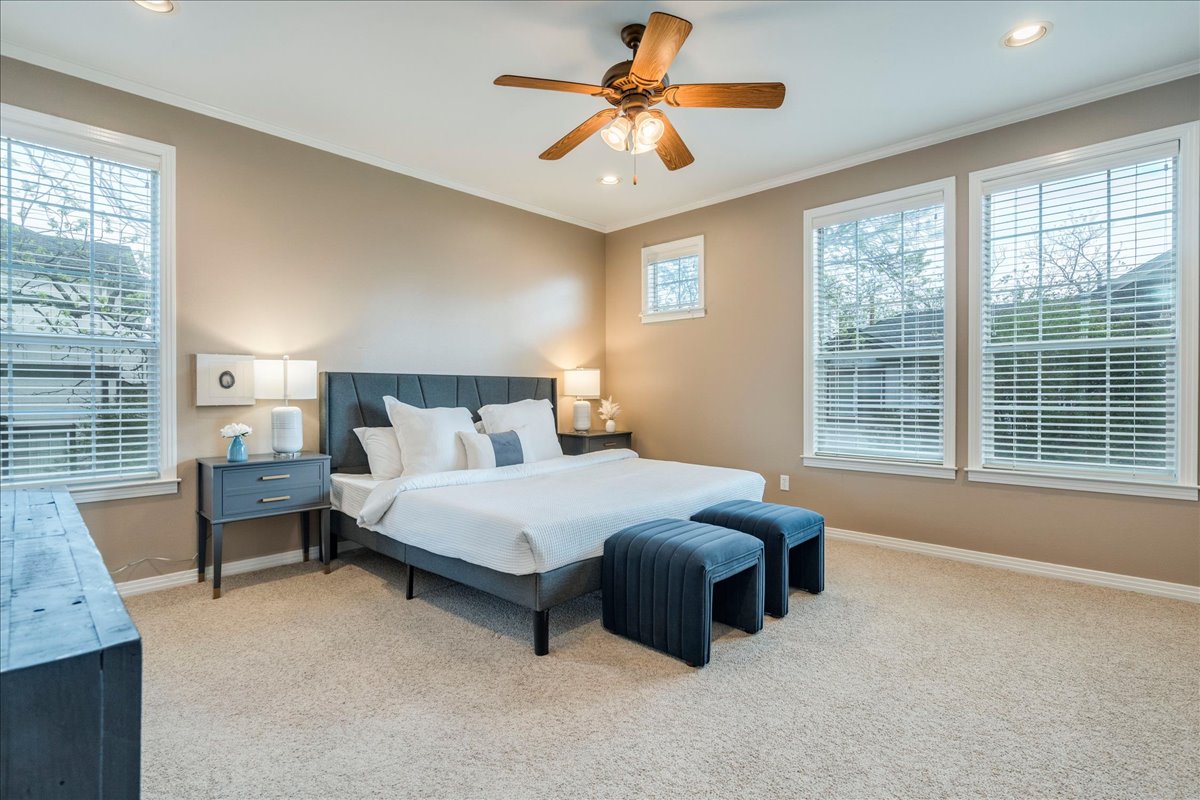 2115 Bluebonnet Lane, Unit 4A Austin, TX 78704 - Photo 13 of 29 a bedroom with a bed dresser and a window