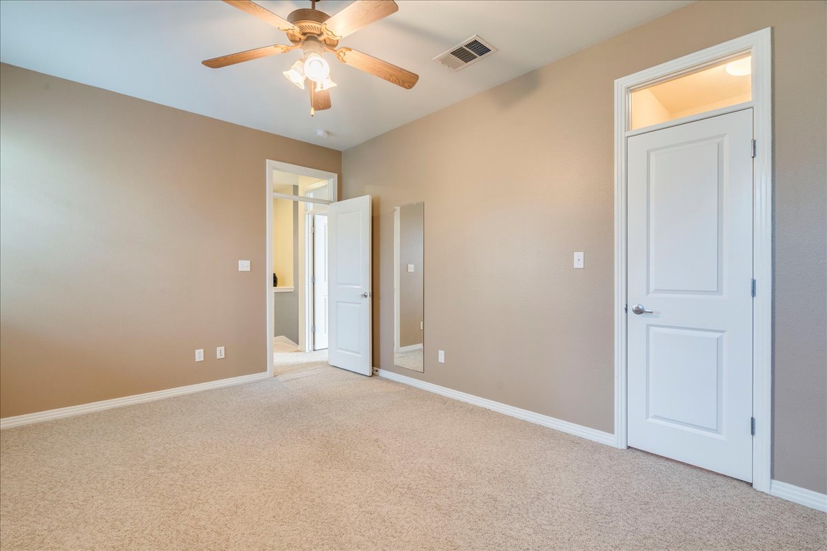 2115 Bluebonnet Lane, Unit 4A Austin, TX 78704 - Photo 18 of 29 a view of an empty room and chandelier fan