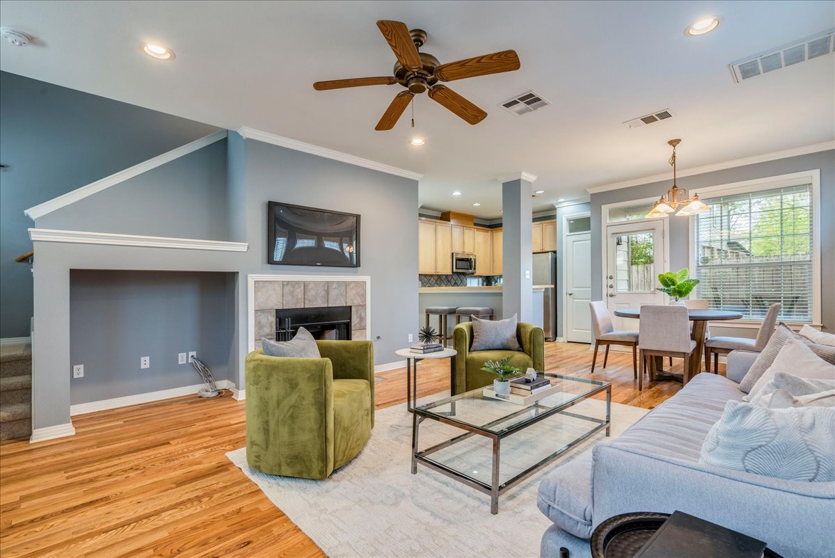 2115 Bluebonnet Lane, Unit 4A Austin, TX 78704 - Photo 2 of 29 a living room with fireplace furniture and a large window
