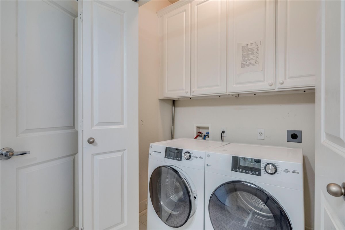 2115 Bluebonnet Lane, Unit 4A Austin, TX 78704 - Photo 22 of 29 a utility room with dryer and washer