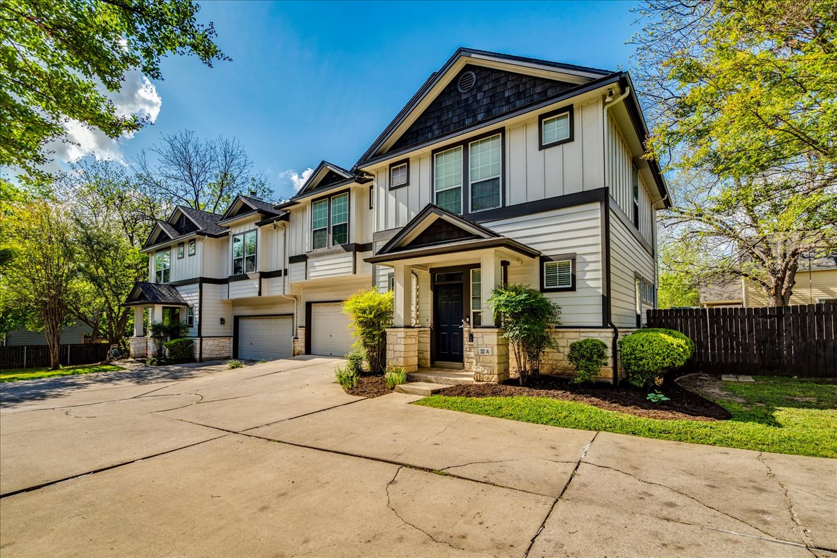 2115 Bluebonnet Lane, Unit 4A Austin, TX 78704 - Photo 28 of 29 a front view of a house with a yard