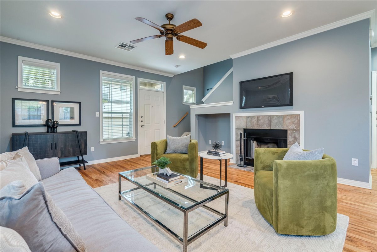2115 Bluebonnet Lane, Unit 4A Austin, TX 78704 - Photo 4 of 29 a living room with furniture and a fireplace