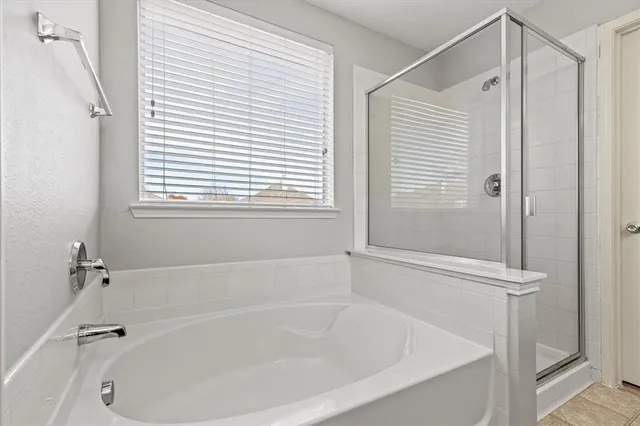 a white bath tub sitting next to a window