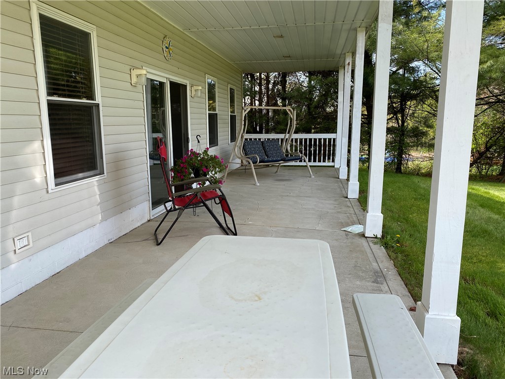 1225 Glecoe Road Southwest Dellroy, OH 44620 - Photo 28 of 33 Guest Area: 10 x 40 Cement/coverd porch on building below house.