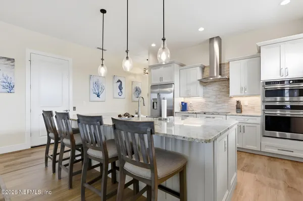 a open kitchen with stainless steel appliances granite countertop a stove and cabinets