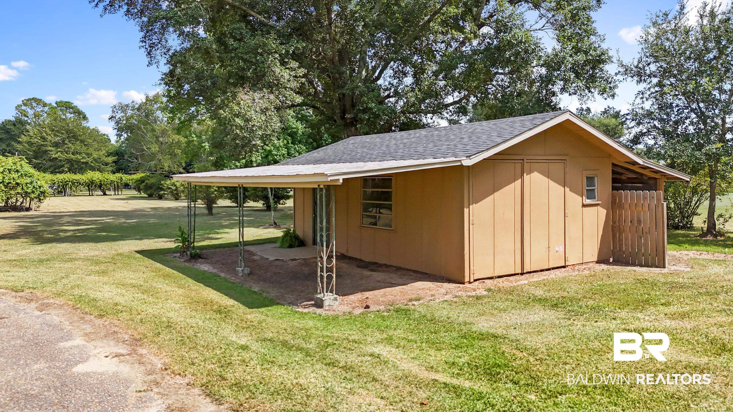 15600 Fackler Road Loxley, AL 36551 - Photo 30 of 51 View of outdoor structure featuring a lawn