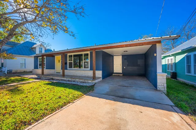 a view of a house with swimming pool