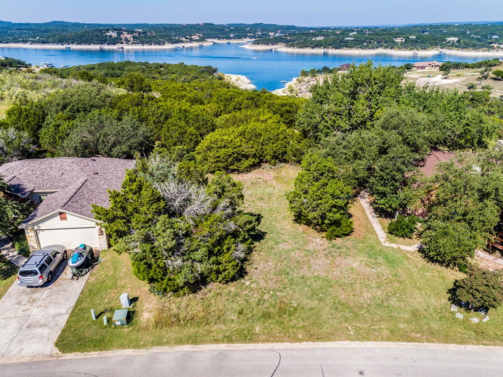 300 Summit Ridge Drive North Point Venture, TX 78645 - Photo 1 of 1 an aerial view of a houses with a lake view