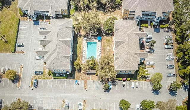 aerial view of residential houses with outdoor space and street view